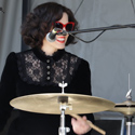 M. Keri drums at an outdoor festival in Her favourite goth dress (2019). 